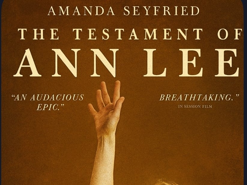 Alt text:  
Sepia-toned movie poster for “The Testament of Ann Lee” featuring An outstretched hand reaches upward in a gesture of spiritual ecstasy. The background is warm brown, with bold serif text displaying the title and critical praise: “An audacious epic” and “Amanda Seyfried is breathtaking