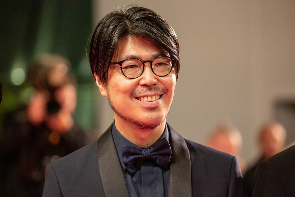 Alt = Genki Kawamura at 2025 Cannes Red Carpet for Exit 8 Exit 8 horror film review