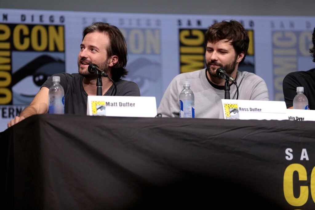 Alt = Matt and Ross Duffer speaking at the 2017 San Diego Comic Con International, for "Stranger Things", at the San Diego Convention Center in San Diego, California.

Please attribute to Gage Skidmore if used elsewhere.

Gage Skidmore from Peoria, AZ, United States of America

Creative Commons Attribution-Share Alike 2.0
The Boroughs Netflix series review
