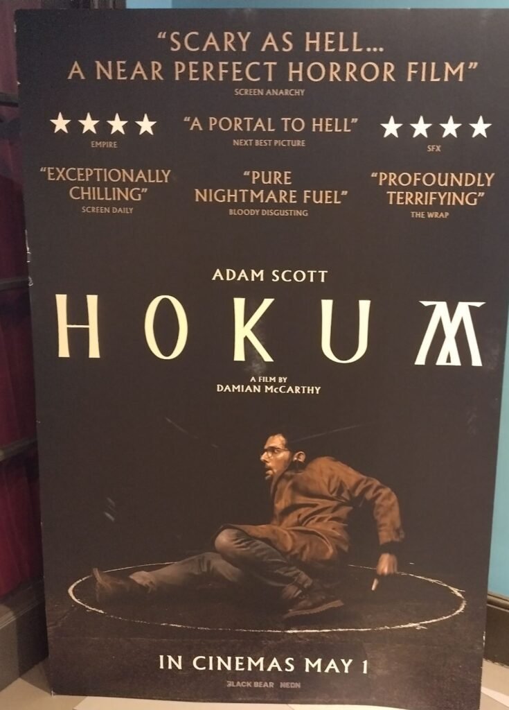 Alt = movie promotional poster for the movie Hokum. Featuring a shot from the film with lead actor Adam Scott 

Hokum Gothic horror movie review