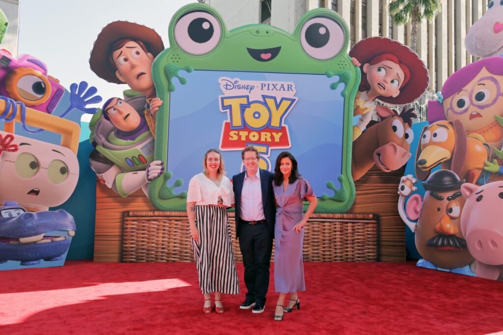 Alt = Kenna Harris, Andrew Stanton, and Lindsey Collins attend the world premiere of 'Toy Story 5' at the Dolby Theatre in Los Angeles.
Toy Story 5 Review
