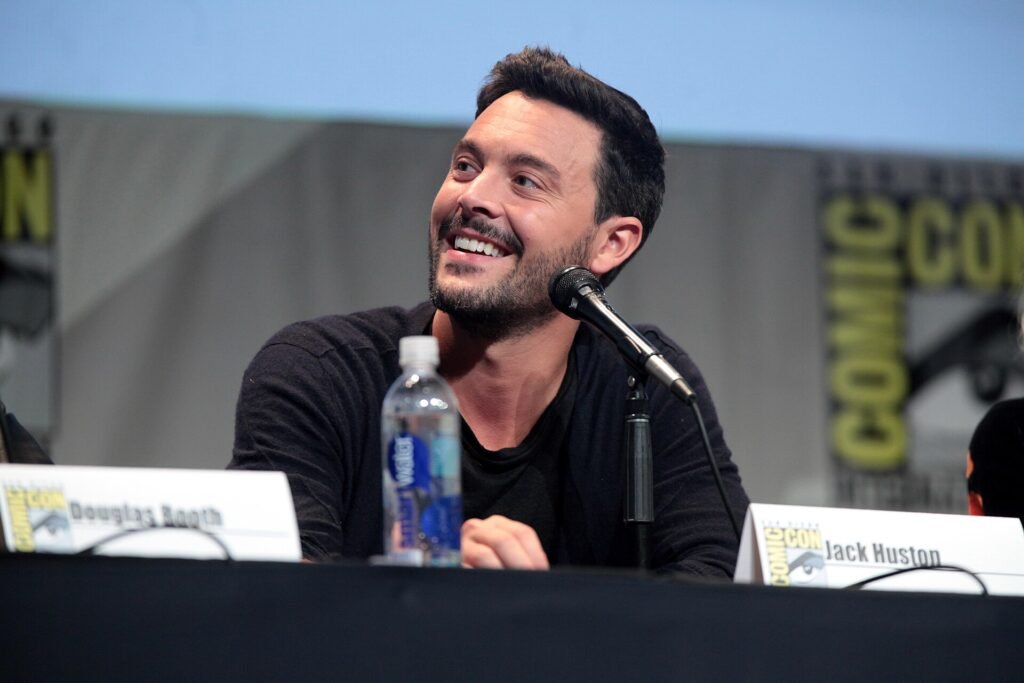Alt = Jack Huston speaking at the 2015 San Diego Comic Con International, for "Pride and Prejudice and Zombies", at the San Diego Convention Center in San Diego, California.
Please attribute to Gage Skidmore if used elsewhere.
Gage Skidmore from Peoria, AZ, United States of America
Creative Commons Attribution-Share Alike 2.0
Spider-Noir TV Series Review