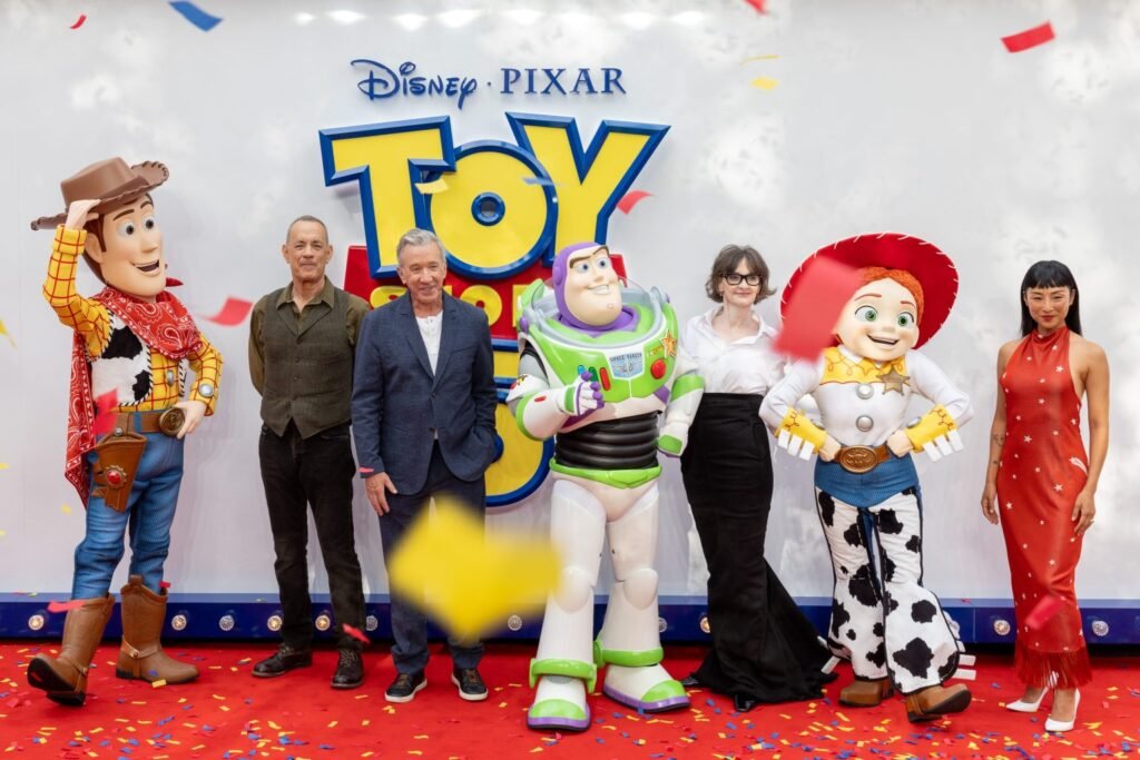 Alt = Woody, Tom Hanks, Disney Legend Tim Allen, Buzz Lightyear, Joan Cusack, Jessie, and Greta Lee attend the UK launch event of Disney and Pixar's 'Toy Story 5' at Odeon Luxe Leicester Square in London. © 2026 Disney/Pixar. All Rights Reserved
Toy Story 5 Review