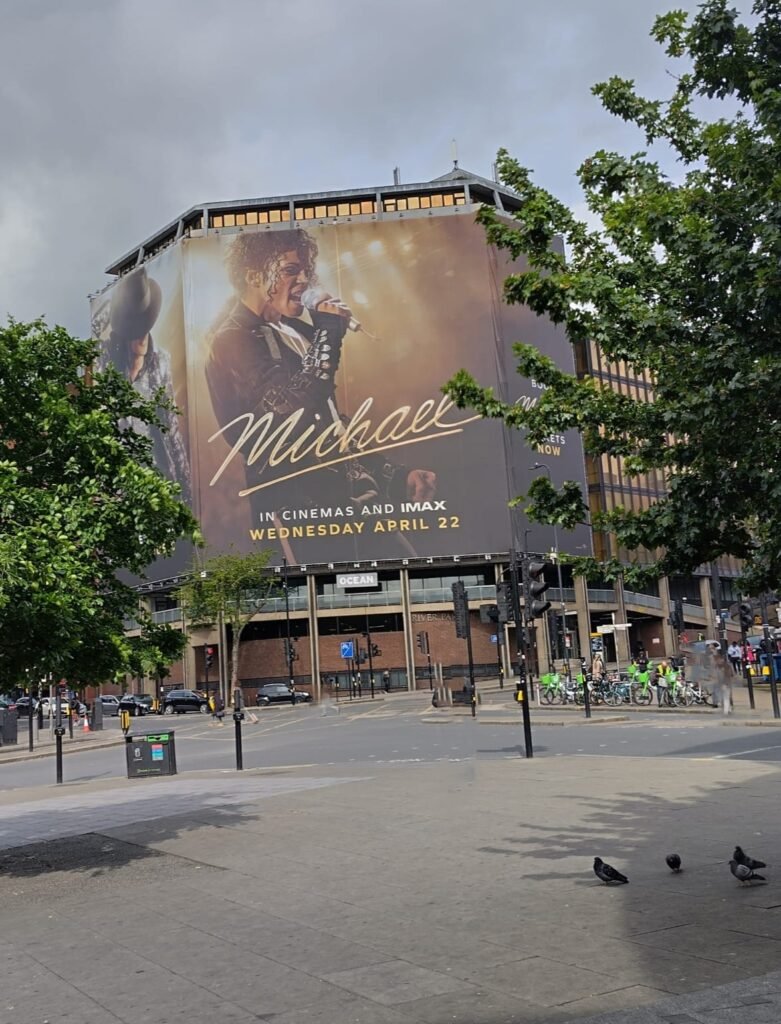 Alt = outdoor display of the movie poster for the movie Michael
Michael Movie Billion-Dollar Success