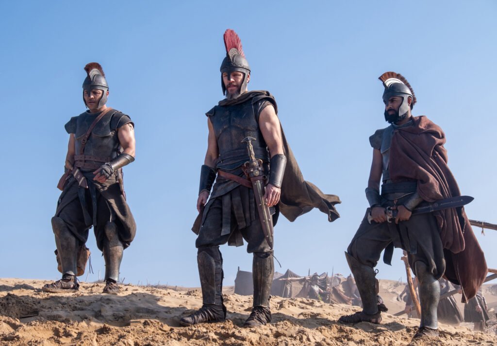 Alt = Center L to R: Jimmy Gonzales is Cepheus, Matt Damon is Odysseus and Himesh Patel is Eurylochus in THE ODYSSEY, written, produced, and directed by Christopher Nolan. © Universal Pictures 2026
The Odyssey Review