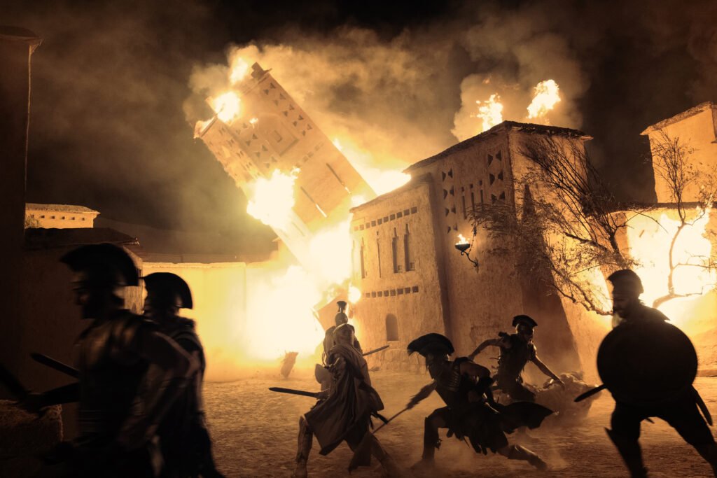 Alt = A scene from the Odyssey showing The Attack On Troy THE ODYSSEY, written, produced, and directed by Christopher Nolan. © Universal Pictures 2026
The Odyssey Review