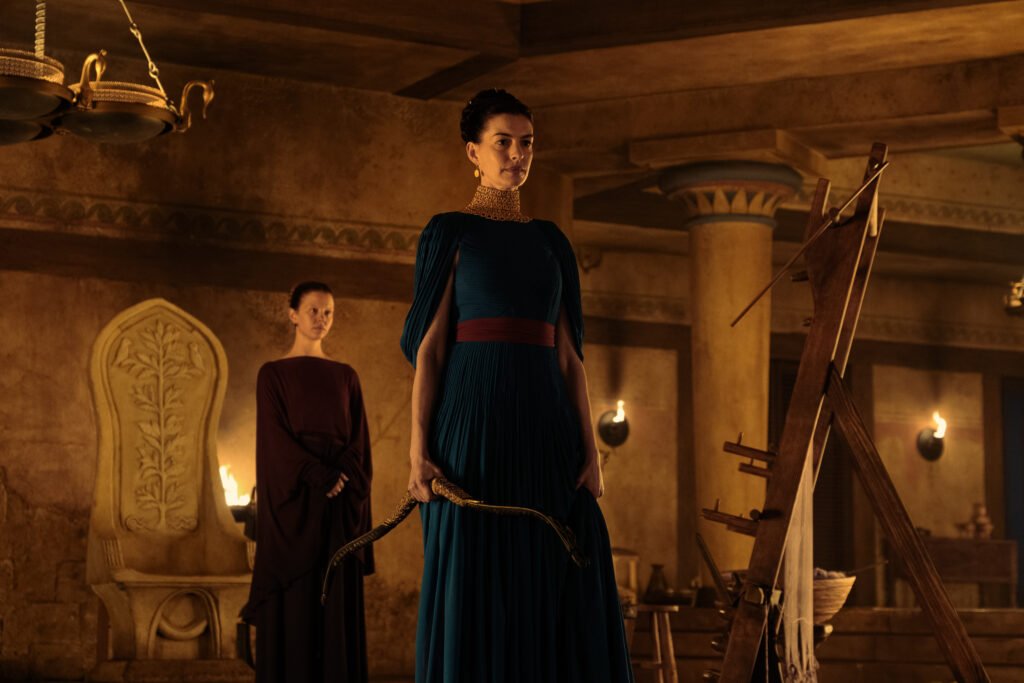 Alt = L to R: Mia Goth is Melantho and Anne Hathaway is Penelope in THE ODYSSEY, written, produced, and directed by Christopher Nolan. © Universal Pictures 2026
The Odyssey Review