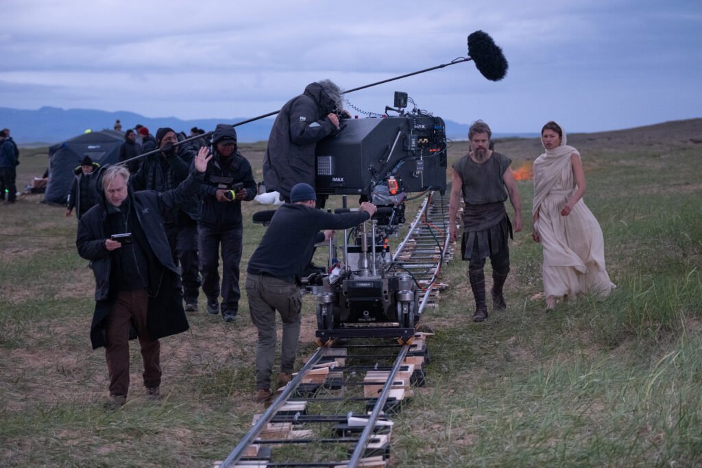 Alt = Director Christopher Nolan (frame left) with Matt Damon (as Odysseus) and Zendaya (as Athena), on set of his film THE ODYSSEY, written, produced, and directed by Christopher Nolan.
The Odyssey Review