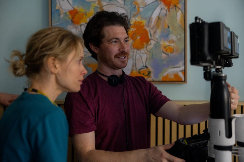 Alt = Actress Amelia Eve And Director Jacob Chase On The Set Of Insidious: Out In The Further. © 2026 Sony Pictures Industries, Inc. and Blumhouse Productions, LLC. All rights reserved.