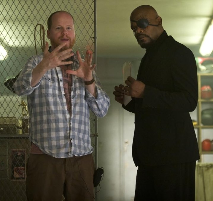 Alt = director Joss Whedon and Samuel L Jackson on the set of The Avengers (2011). ©Marvel Studios and the Walt Disney Company. All rights reserved.