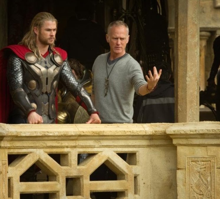 Alt = Chris Hemsworth and director Alan Taylor on the set of Thor The Dark World (2013). ©Marvel Studios and the Walt Disney Company. All rights reserved.
Thor: The Dark World Review