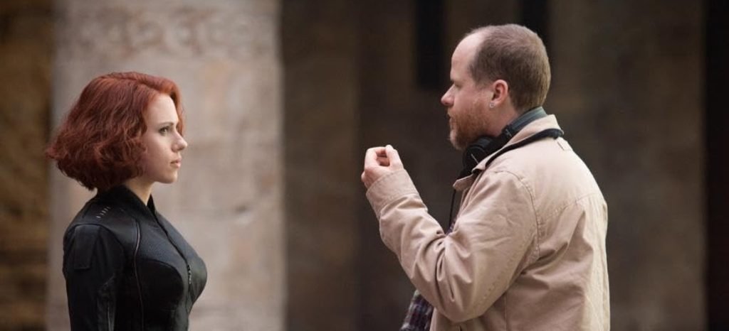 Alt = Scarlett Johansson And Director Joss Whedon On the set of The Avengers Age Of Ultron (2015). ©Marvel Studios and the Walt Disney Company. All rights reserved.