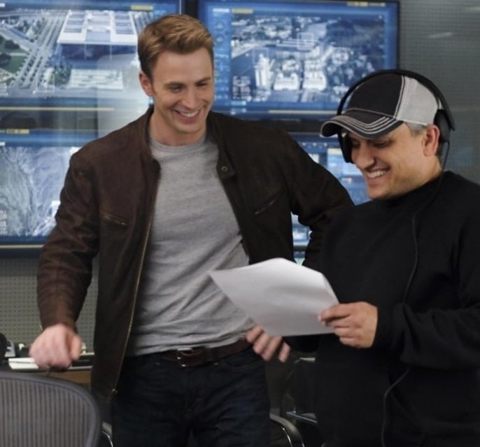 Alt = Chris Evans and Joe Russo on the set of Captain America: Civil War (2016) ©Marvel Studios and the Walt Disney Company. All rights reserved.
Captain America Civil War Review
