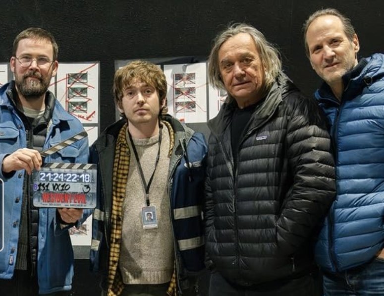 Alt = Zach Cregger, Austin Abrams, Dariusz Wolski, Robert Bernacchi, on the set of Resident Evil (2026) Image Credit: © 2026 Sony Pictures Entertainment / Constantin Film. All rights reserved.
Resident Evil 2026 Review