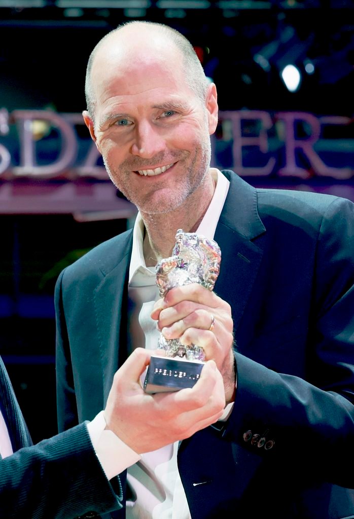 Alt = Tristan Goligher and Lance Hammer pose with the Silver Bear Jury Prize for “Queen at Sea” on the red carpet after the Award Ceremony of Berlinale 2026 in Berlin, Germany By Elena Ternovaja ©Creative Commons Attribution-Share Alike 3.0